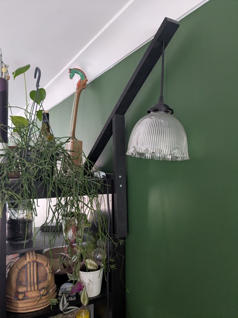 a wooden lamp fixing with a glass lightshade