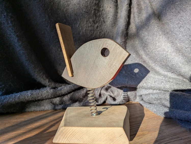 A wooden robin sculpture